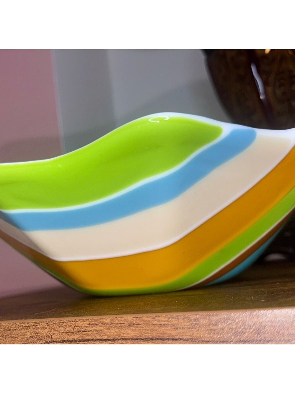 Bowl big blue brown lime green orange tan. White inside. 11 1/2 inch no flaws. ￼